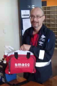 Minh demonstrates SMACC2013 conference bag as airway kit bag