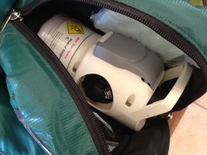 OXYGEN CYLINDER runs the lengt of the green bag/backpack